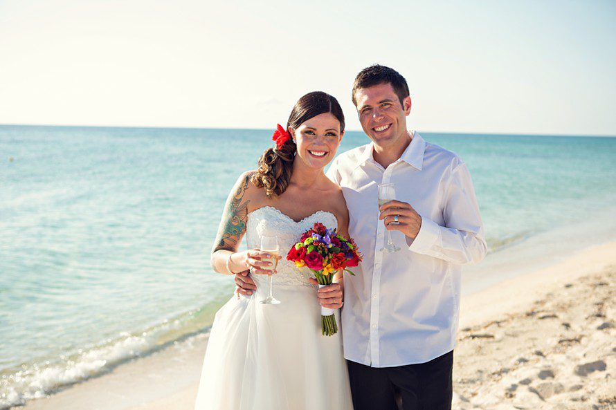 newlyweds celebrate on the beach