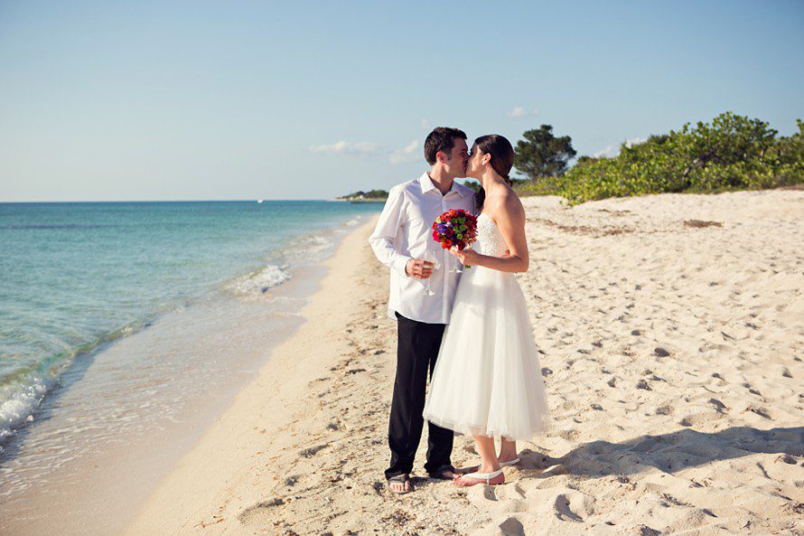 newlyweds on the beach after wedding