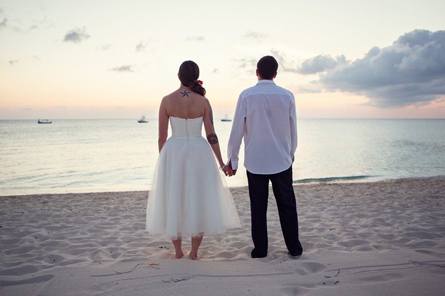 newlyweds at beach for sunset