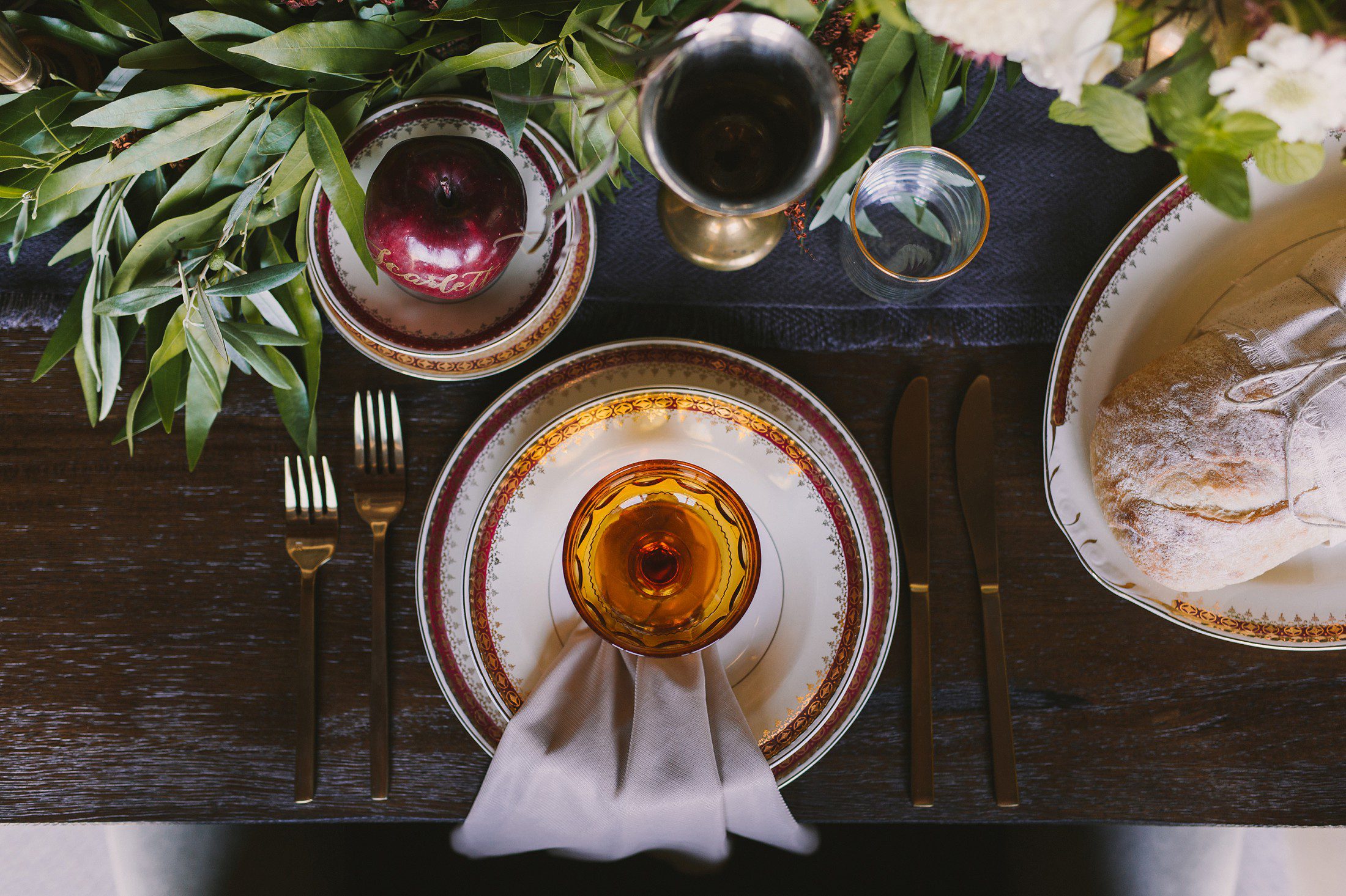 place setting with amber glasses