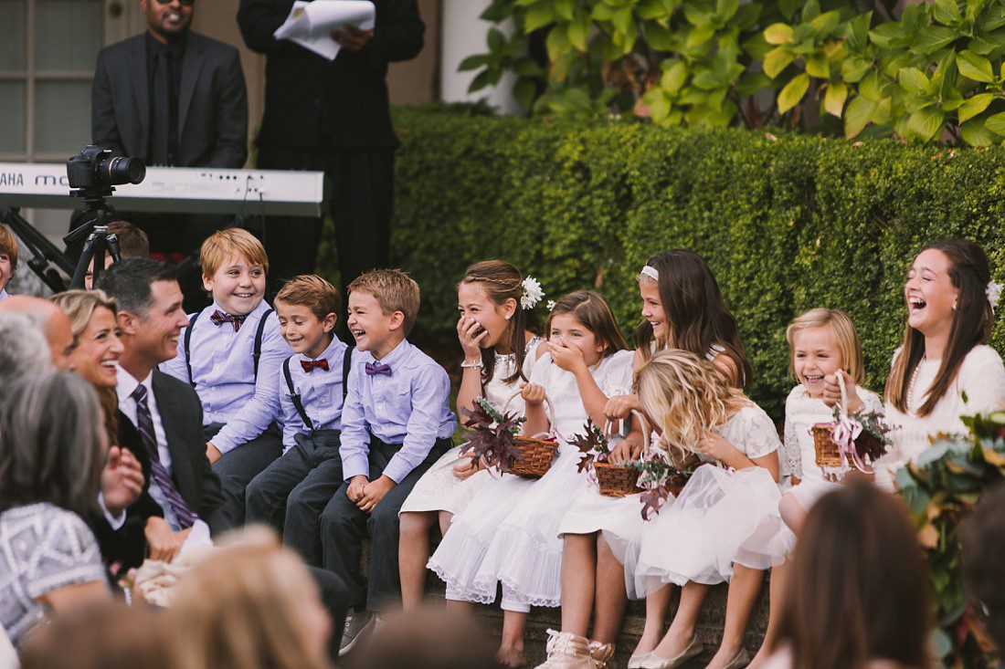 Children giggling during wedding ceremony