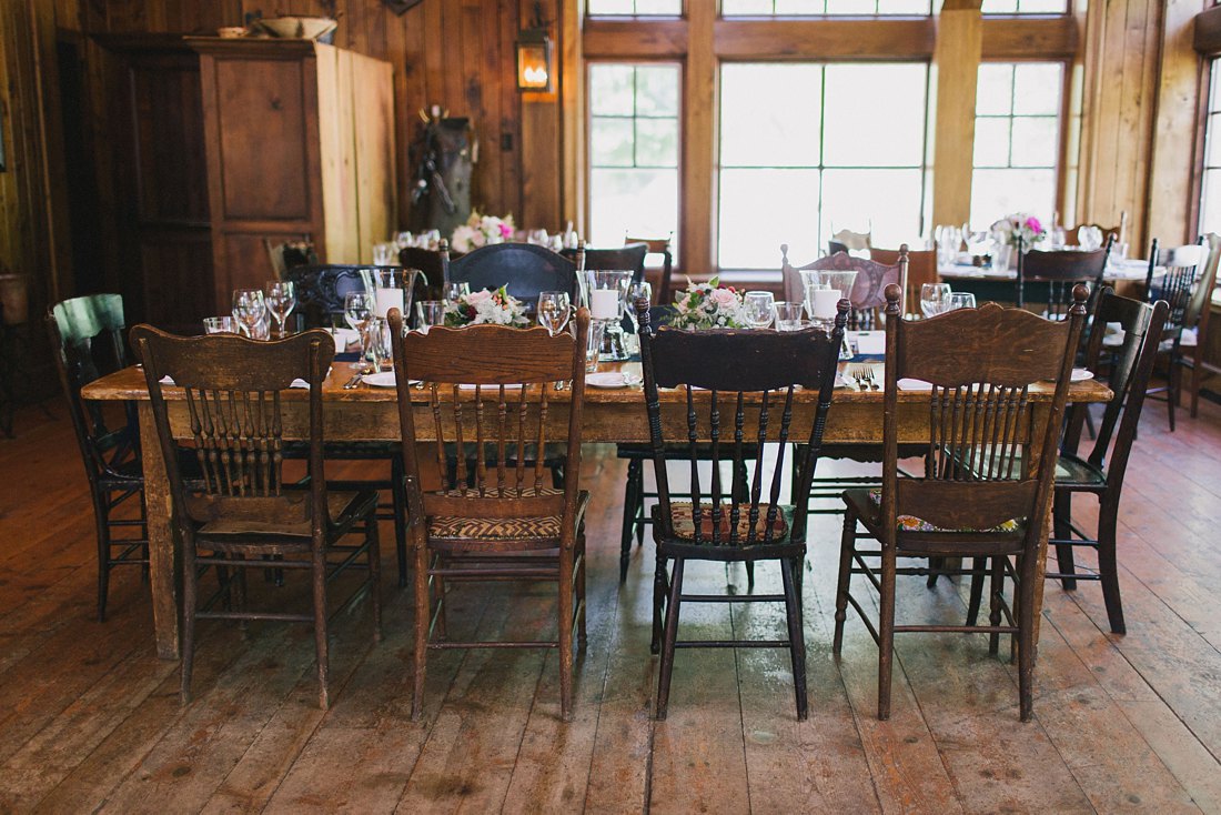 mismatched wooden chairs at saddleridge wedding