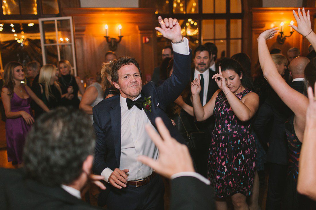 father dancing at reception
