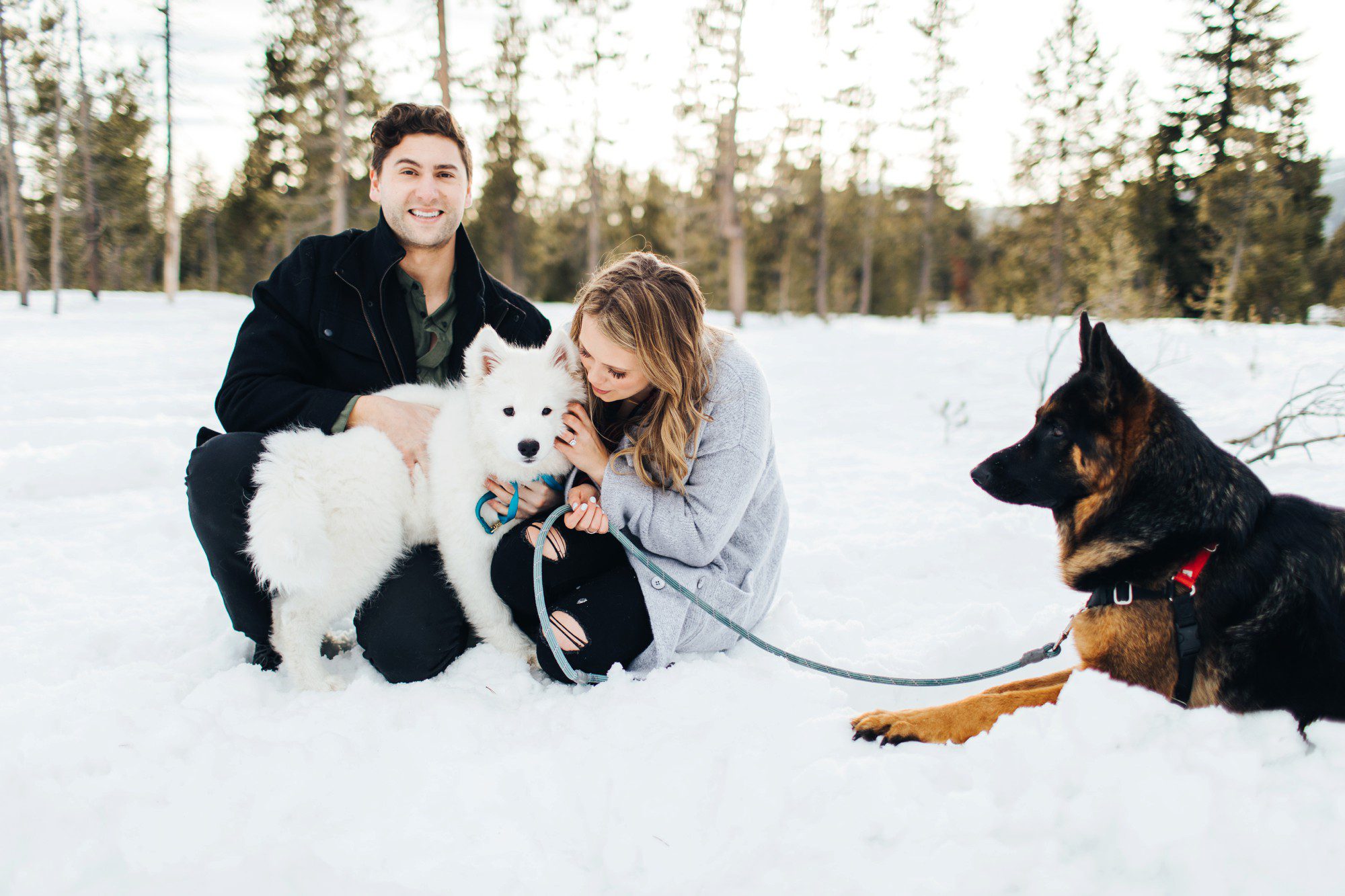 Candid photo of couple with their dogs in Central Oregon