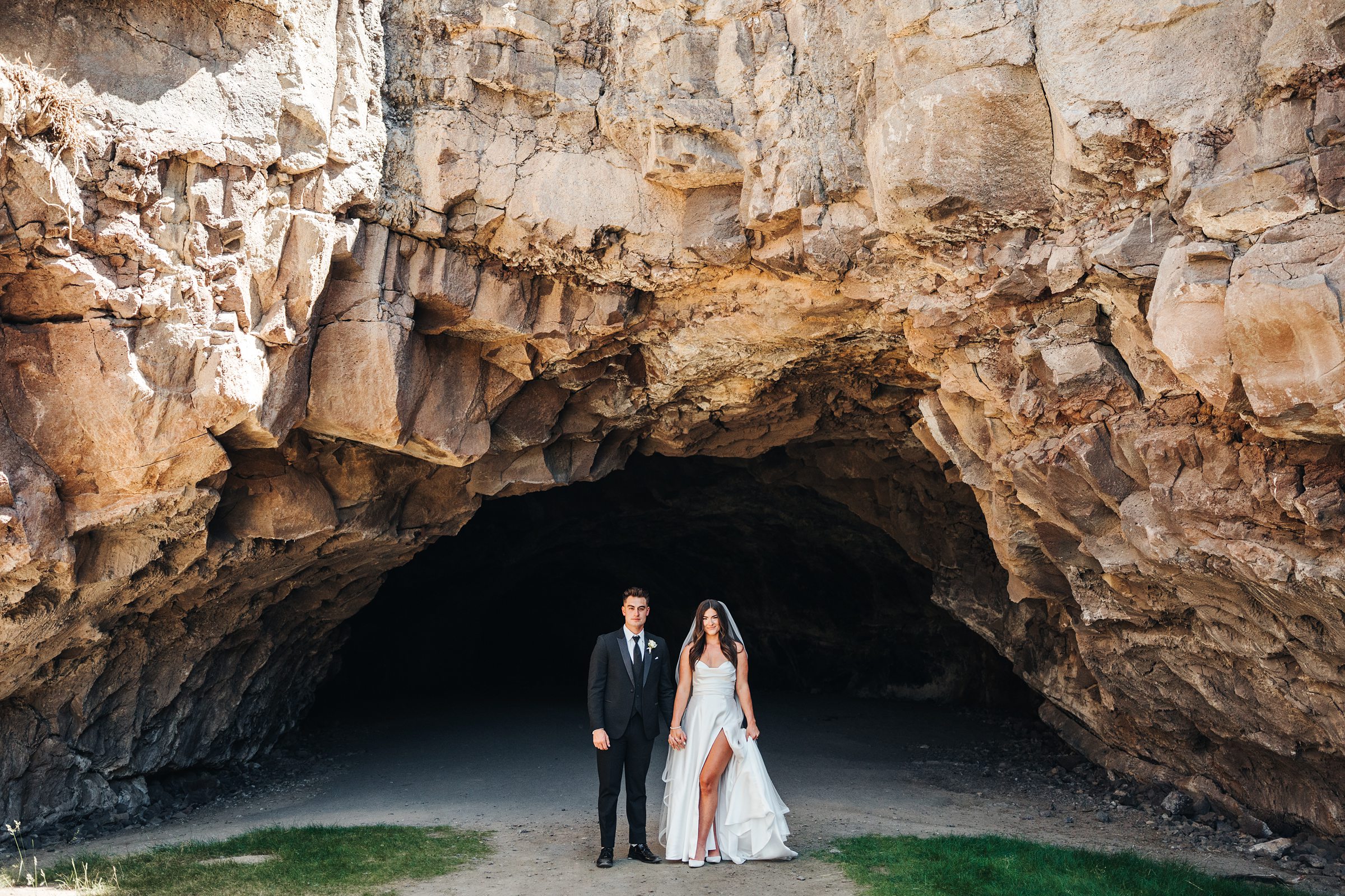 Juniper Preserve Wedding and couple standing at the cave